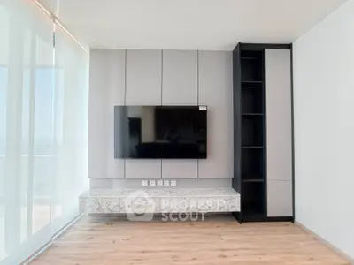 Modern living room with sleek TV setup and marble accents