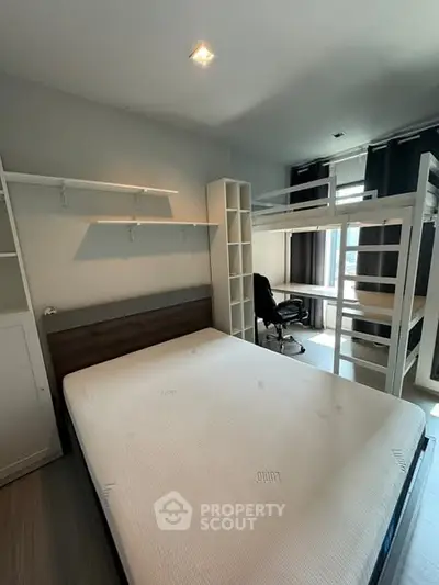 Modern bedroom with loft bed and study area, ideal for maximizing space in urban apartments.