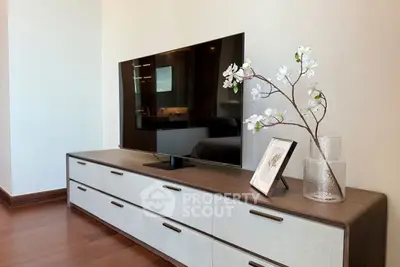 Modern living room with sleek TV stand and decorative accents