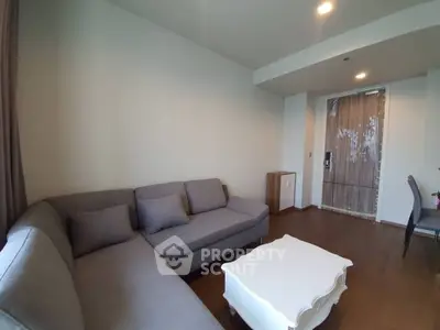 Cozy living room with modern gray sofa and stylish white coffee table