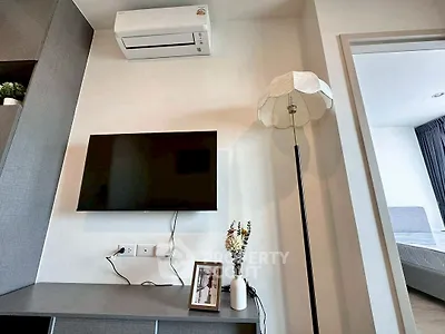 Modern living room with wall-mounted TV and stylish decor