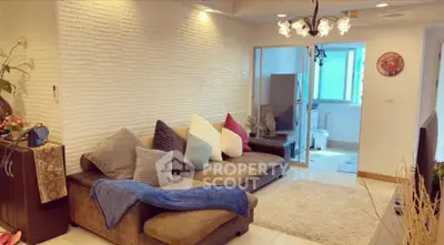 Spacious living room with cozy sectional sofa and modern decor in a stylish apartment.