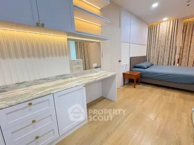 Spacious bedroom with elegant built-in storage and cozy lighting