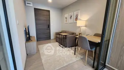 Modern living room with cozy seating and stylish decor in a contemporary apartment.