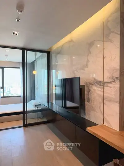 Modern living room with sleek design and marble accent wall