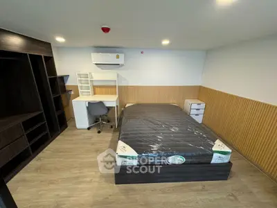 Modern furnished bedroom with study area and built-in wardrobe