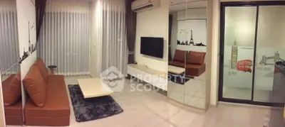 Modern living room with stylish decor and large windows in a contemporary apartment.