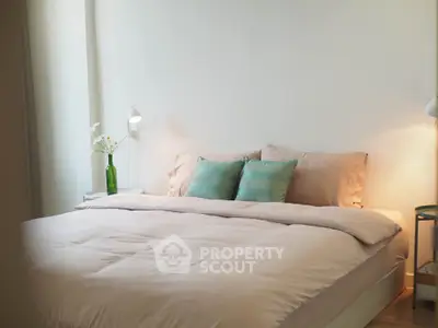 Cozy bedroom with soft lighting and elegant decor, perfect for relaxation.