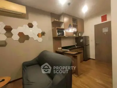 Cozy modern living room with compact kitchen and stylish decor
