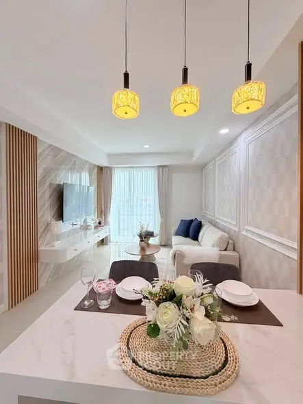 Elegant modern living room with stylish decor and open layout, featuring a cozy seating area and chic lighting.