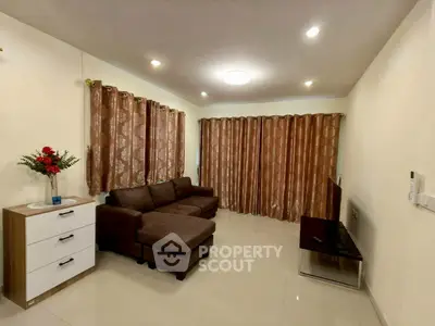 Spacious living room with elegant brown sofa and modern decor
