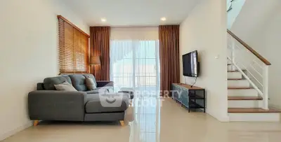 Spacious modern living room with sleek furniture and natural light