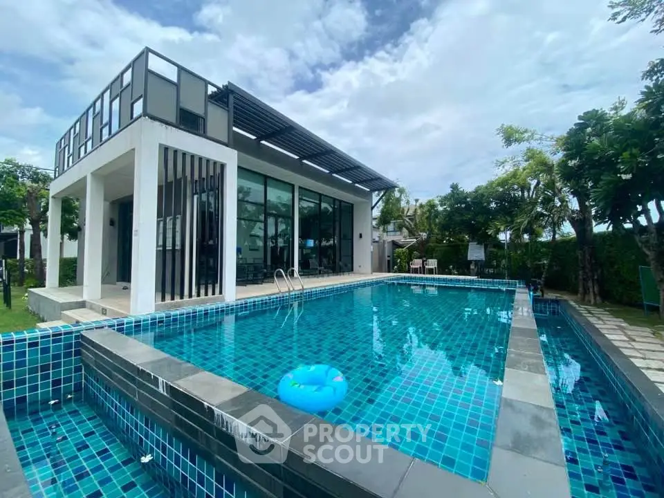 Luxurious modern villa with private pool and lush garden, perfect for relaxation and entertaining.