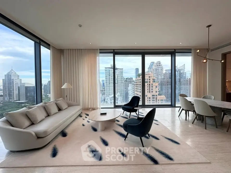 Luxurious modern living room with panoramic city views and elegant furnishings.