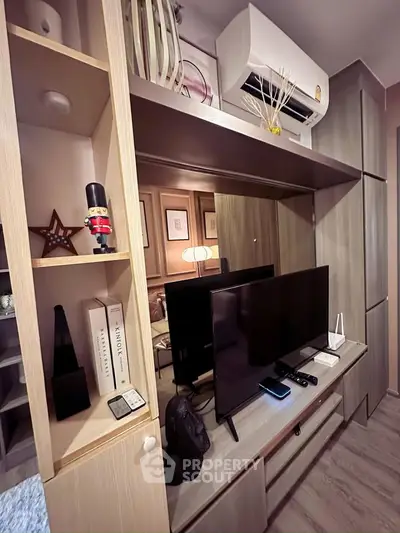 Modern living room with stylish wooden shelving and entertainment center