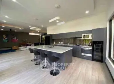Modern open-layout kitchen with sleek design and island seating