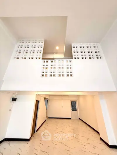 Spacious modern interior with unique architectural design and high ceilings