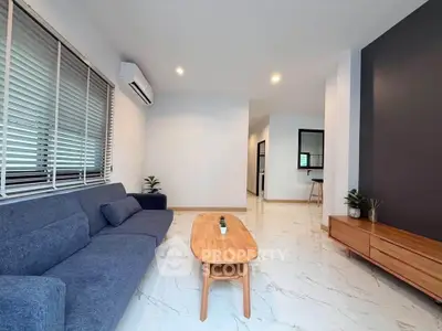 Modern living room with sleek furniture and stylish decor