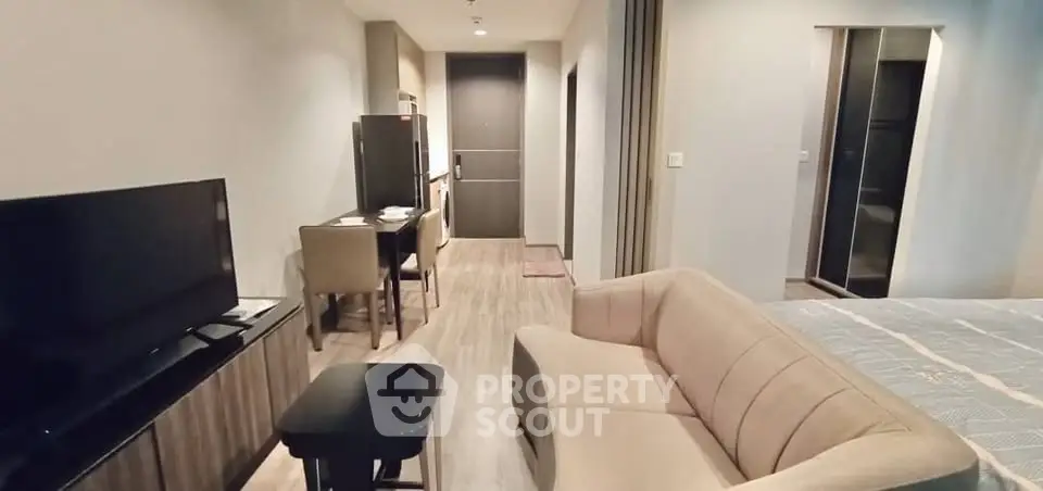 Modern living room with cozy sofa and TV in stylish apartment