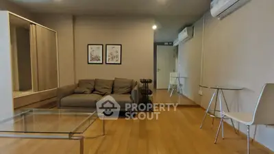 Spacious living room with modern furniture and wooden flooring