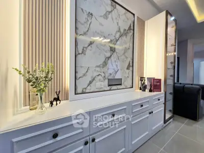 Luxurious modern living room with elegant marble wall and sleek cabinetry