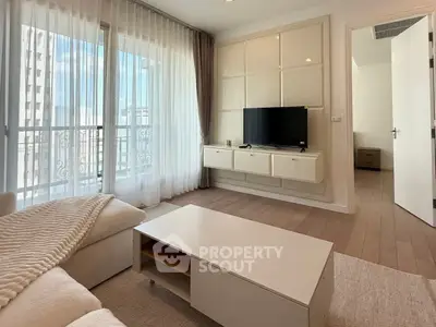 Modern living room with large windows and stylish furniture