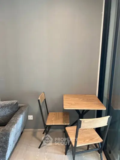 Cozy corner with modern table and chairs in stylish apartment