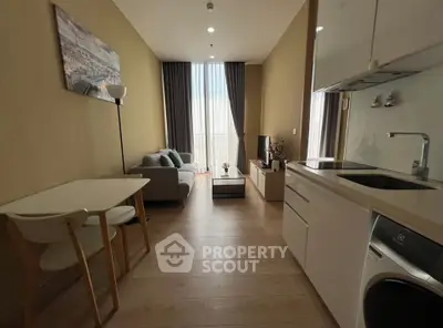 Modern living room with open kitchen and cozy decor