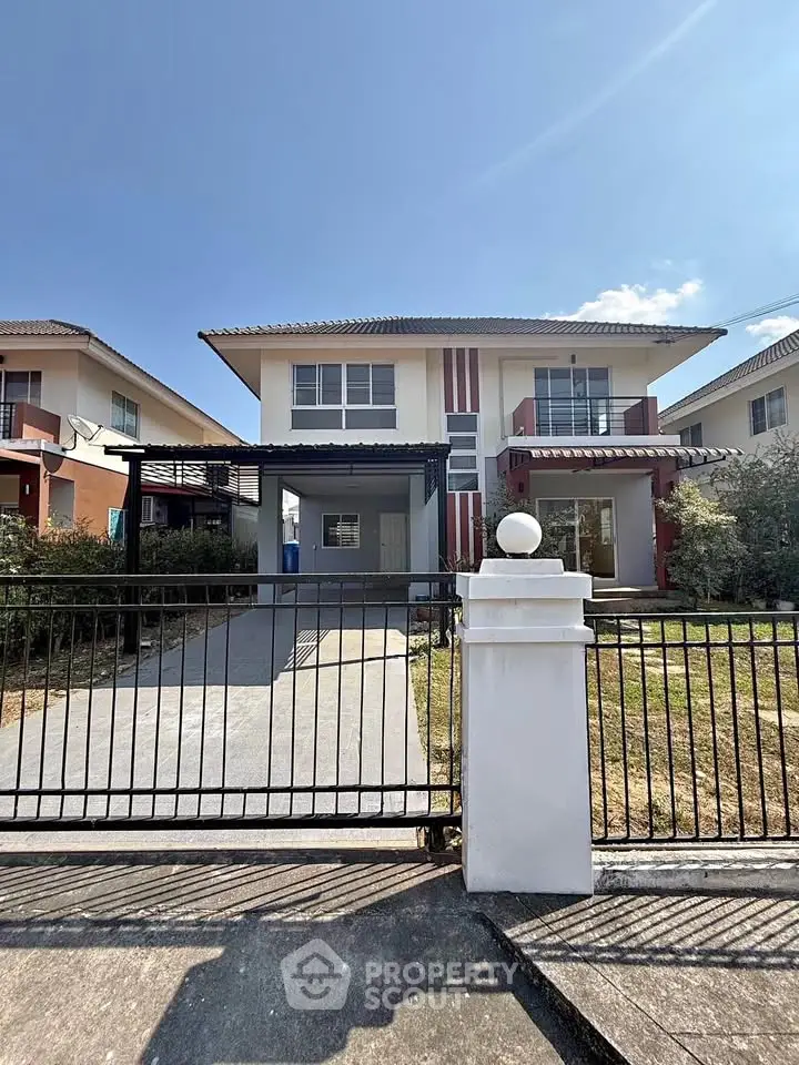 Charming two-story house with spacious driveway and modern facade in a serene neighborhood.