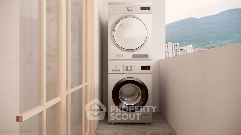 Modern laundry area with stacked washer and dryer on balcony with scenic view.