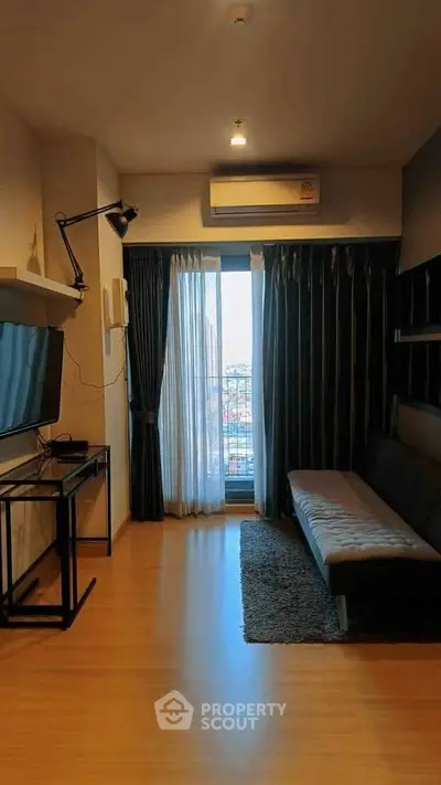 Modern living room with city view, sleek furniture, and natural light.