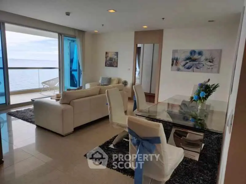 Luxurious living room with ocean view and elegant dining area