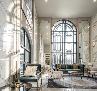 Luxurious living room with high ceilings and elegant decor