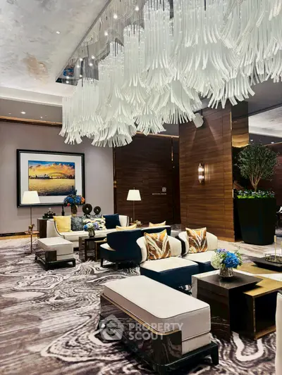Luxurious modern living room with elegant chandelier and stylish decor