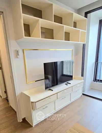 Modern living room with sleek TV unit and stylish shelving, perfect for contemporary urban living.