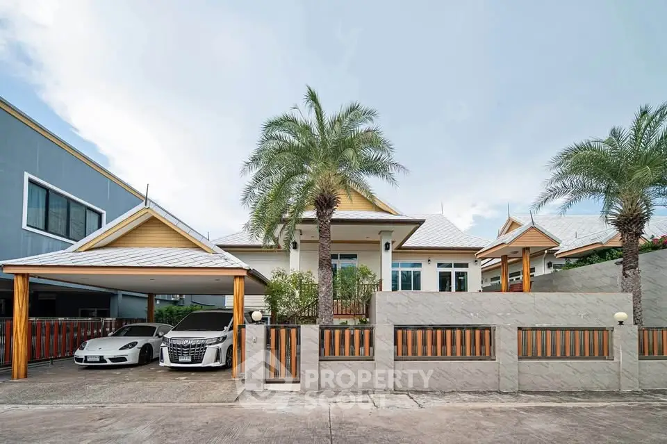 Stunning modern house with palm trees and spacious driveway