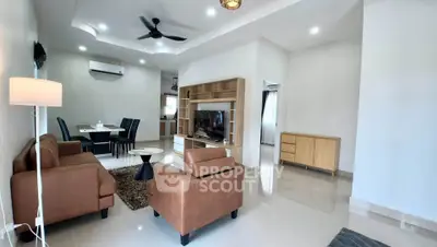 Spacious modern living room with elegant furniture and open dining area