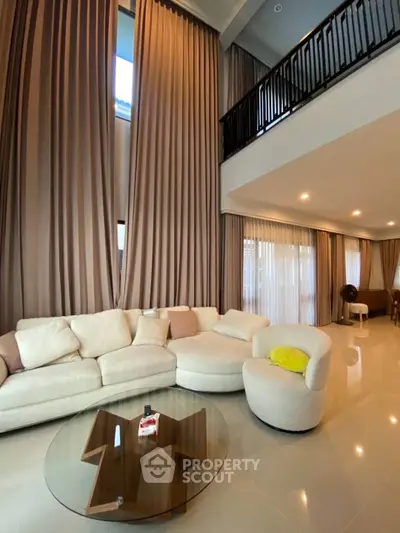 Luxurious living room with high ceilings and elegant decor