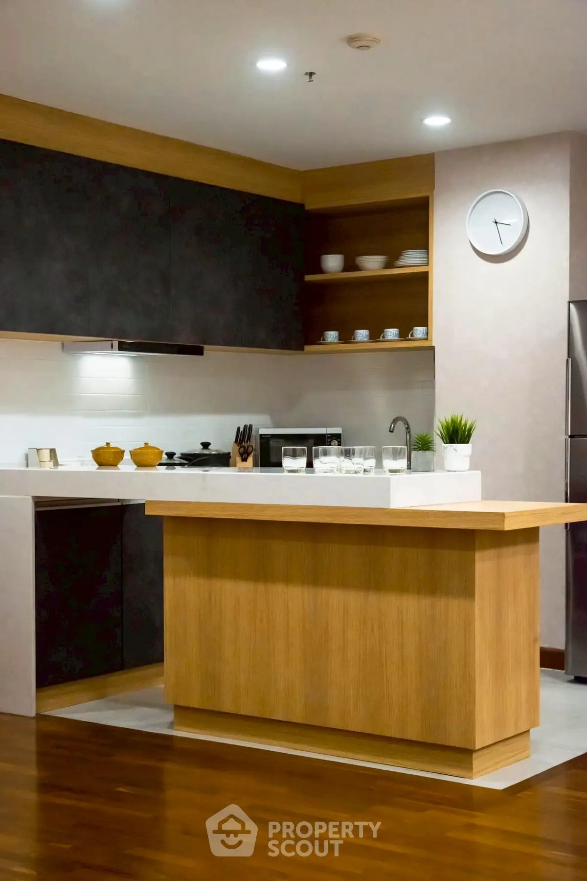 Modern kitchen with sleek design and wooden island