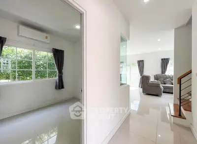 Modern living area with sleek design and natural light