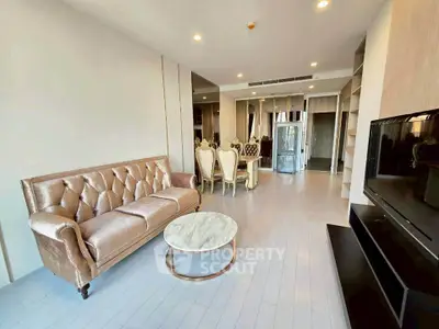 Luxurious living room with elegant sofa and modern decor in upscale apartment