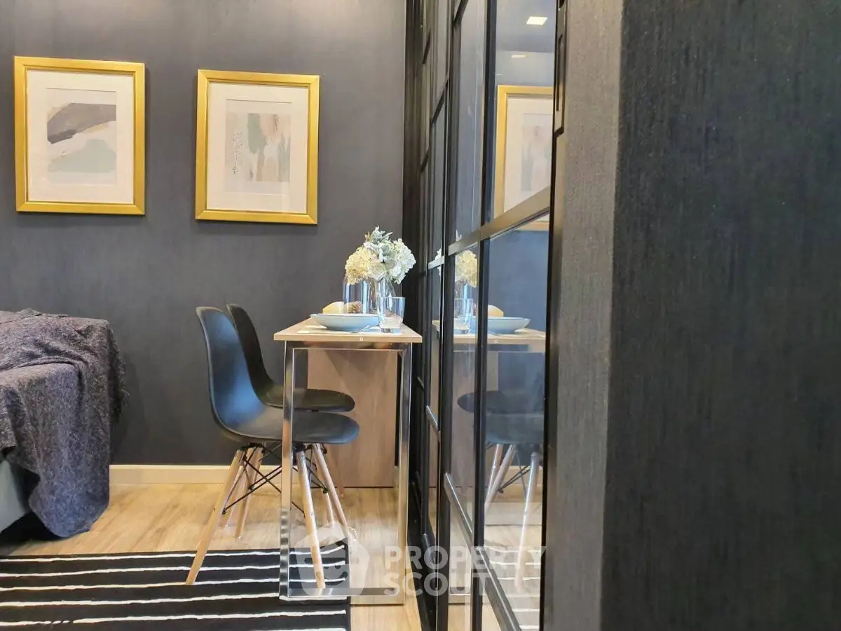 Modern compact dining area with stylish decor and elegant wall art