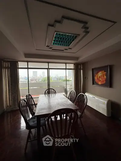 Spacious dining room with city view and elegant ceiling design