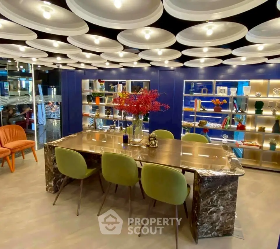 Luxurious modern dining area with unique ceiling design and elegant decor