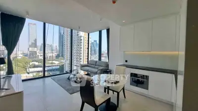 Modern living room with floor-to-ceiling windows and city view in luxury apartment