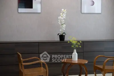 Elegant modern living room with stylish wooden furniture and decorative plants.
