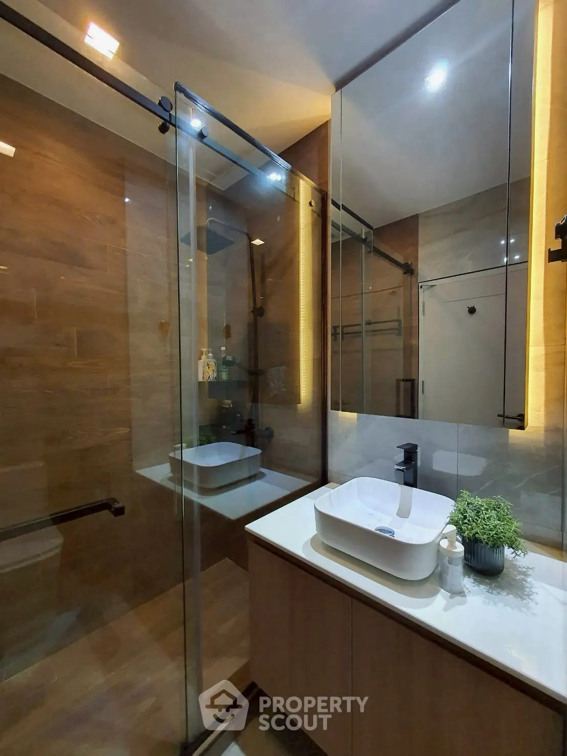 Modern bathroom with glass shower and sleek vanity