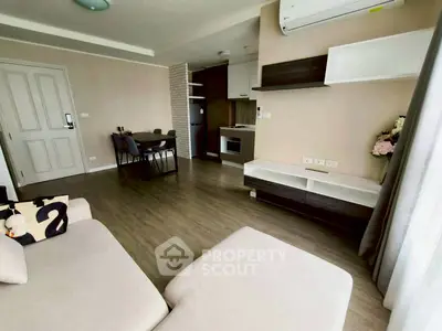 Modern living room with open kitchen and stylish decor