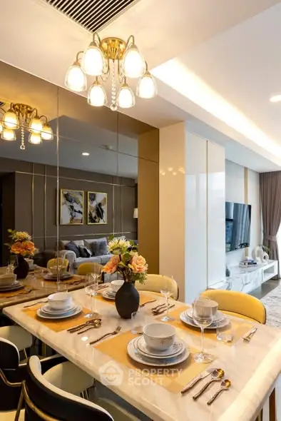 Luxurious dining area with elegant table setting and modern decor in a stylish apartment.