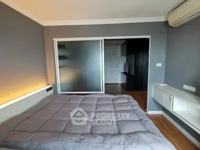 Modern bedroom with sliding glass door and air conditioning